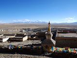 44 Chorten And Mani Wall At North End Of Darchen Village With Barkha Plain Stretching To Gurla Mandhata I climb up above the chorten and mani wall on the northern edge of Darchen for a view of the village and the Barkha Plain stretching to Gurla Mandhata.